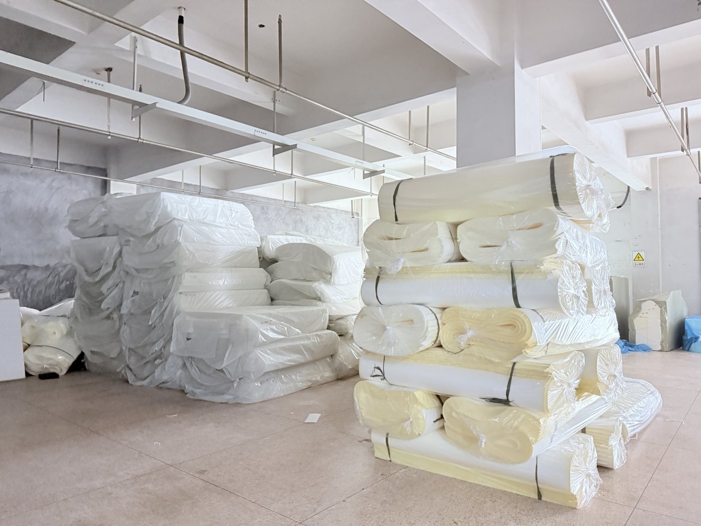 Foam material rolls and sheets stored in the factory